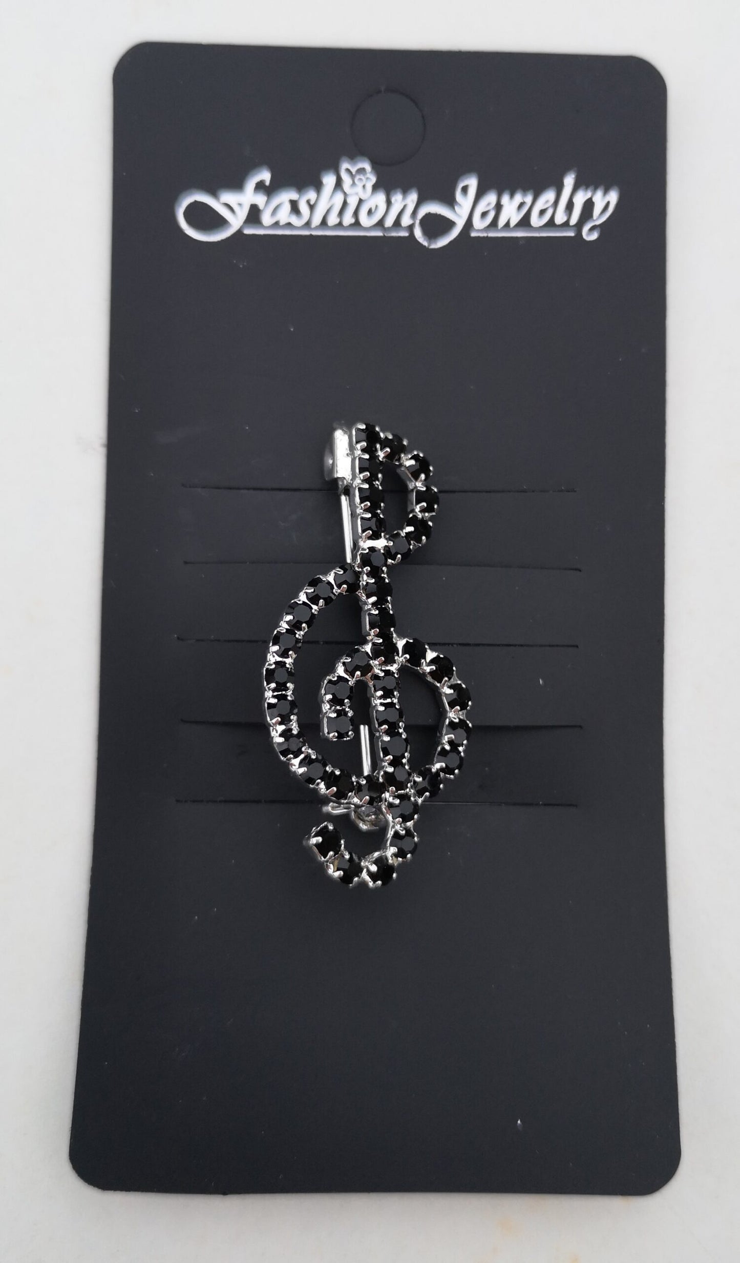Treble Clef black-stoned diamante crystal pin brooch image 1